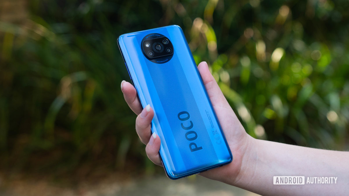 Xiaomi-Poco-X3-NFC-held-in-the-hand-outside-to-show-off-the-rear-side-1200x675