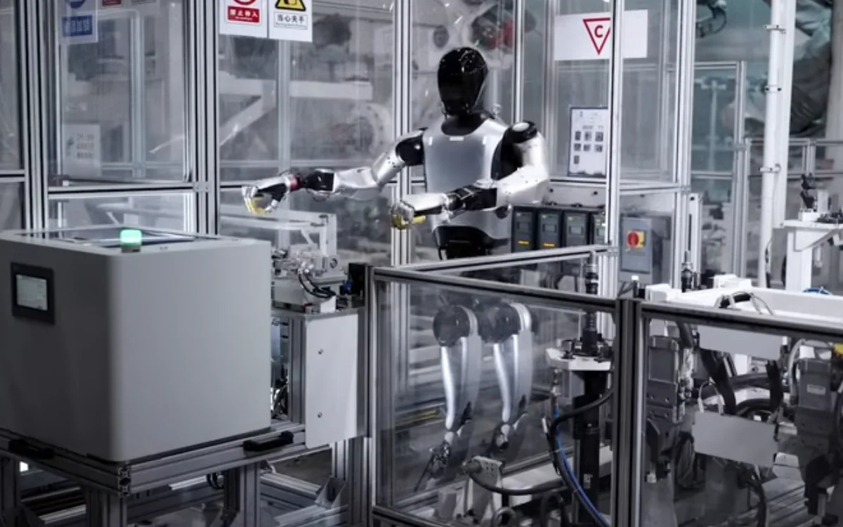 Robot 'thực tập sinh' của Xiaomi theo kịp dây chuyền xe điện 76 giây/chiếc - Ảnh 1.